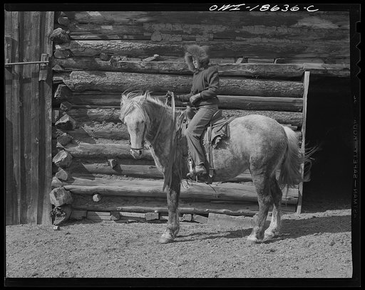 Moreno Valley, Colfax County, New Mexico. Daughter of George Mutz, a cattleman, mounted and ready for work