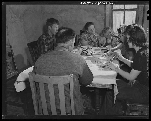 Untitled photo, possibly related to: Moreno Valley, Colfax County, New Mexico. The Mutz family at dinner
