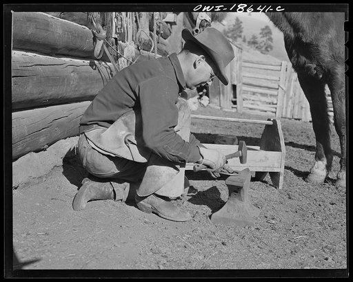 Moreno Valley, Colfax County, New Mexico. William Heck, straightening and fitting a "cold-forged" horseshoe