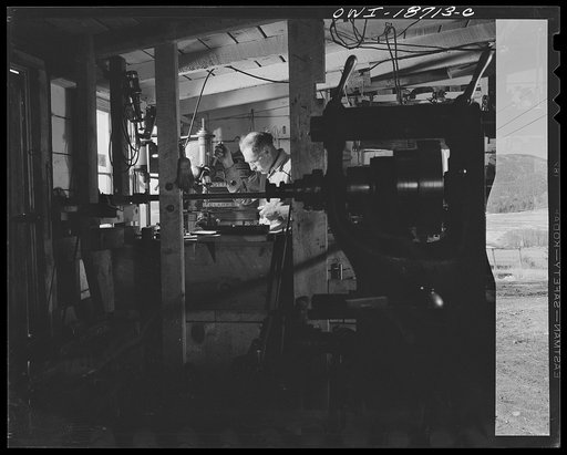 Untitled photo, possibly related to: Moreno Valley, Colfax County, New Mexico. George Turner, a gunsmith as well as a cattleman, working in his shop