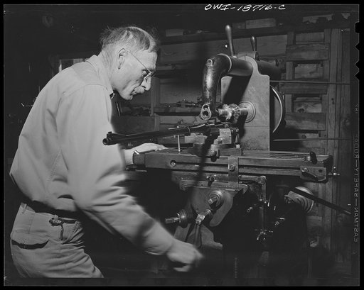 Untitled photo, possibly related to: Moreno Valley, Colfax County, New Mexico. George Turner, a gunsmith as well as a cattleman, working in his shop