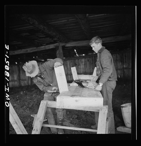 Moreno Valley, Colfax County, New Mexico. George Mutz and his son building a feed trough