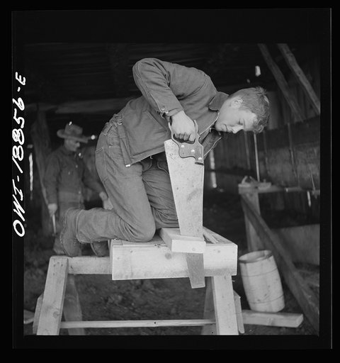 Moreno Valley, Colfax County, New Mexico. George Mutz and his son building a feed trough