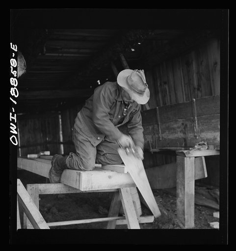 Untitled photo, possibly related to: Moreno Valley, Colfax County, New Mexico. George Mutz and his son building a feed trough