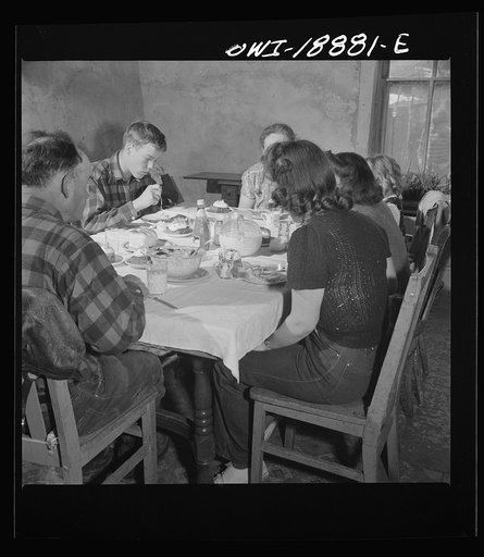 Untitled photo, possibly related to: Moreno Valley, Colfax County, New Mexico. The Mutz family at dinner