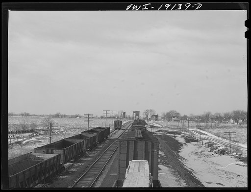 Untitled photo, possibly related to: Main line tracks and a town along the tracks of the Atchison, Topeka and Santa Fe Railroad. Marceline, Missouri