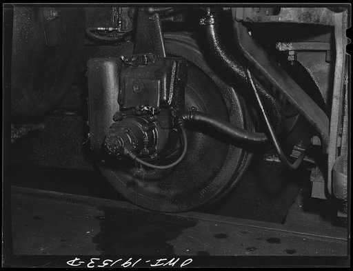 Shopton, near Fort Madison, Iowa. Train control mechanism installed on a truck wheel of an engine in the Atchison, Topeka and Santa Fe Railway roundhouse
