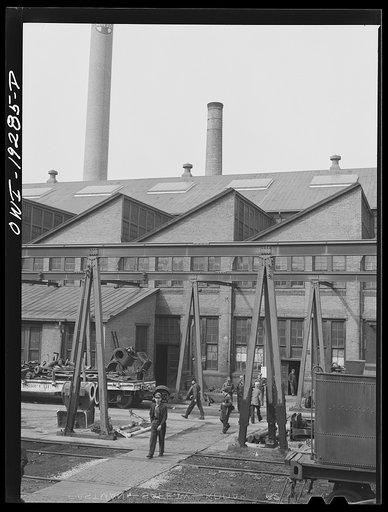 Topeka, Kansas. Workmen coming out of the Atchison, Topeka and Santa Fe Railroad locomotive shops during lunch period