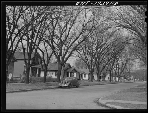 Untitled photo, possibly related to: Topeka, Kansas. One of the streets where many of the workers in the Atchison, Topeka and Santa Fe Railroad locomotive shops live