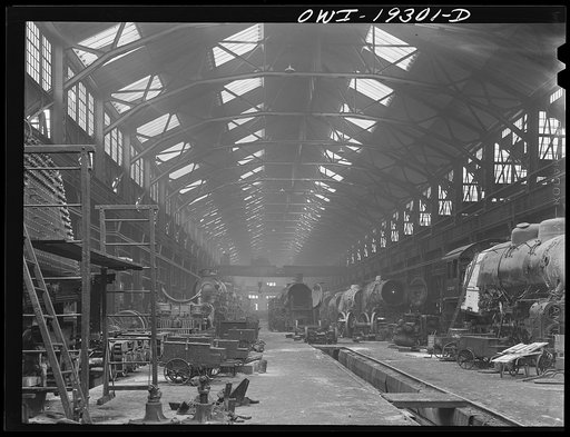 Topeka, Kansas. General view of part of the Atchison, Topeka and Santa Fe Railroad locomotive shops during lunch period