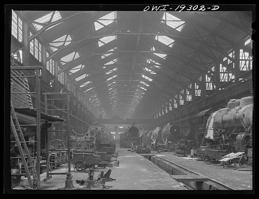 Untitled photo, possibly related to: Topeka, Kansas. General view of part of the Atchison, Topeka and Santa Fe Railroad locomotive shops during lunch period