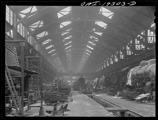 Untitled photo, possibly related to: Topeka, Kansas. General view of part of the Atchison, Topeka and Santa Fe Railroad locomotive shops during lunch period