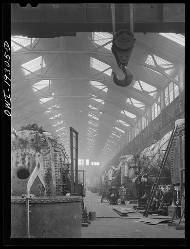 Topeka, Kansas. General view of part of the Atchison, Topeka and Santa Fe Railroad locomotive shops during lunch period