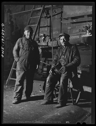 Topeka, Kansas. Two Mexican workers employed at the Atchison, Topeka and Santa Fe Railroad locomotive shops