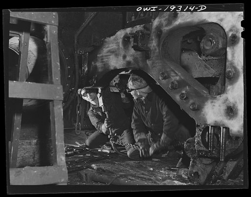 Topeka, Kansas. Working underneath an engine in the Atchison, Topeka and Santa Fe Railroad locomotive shops