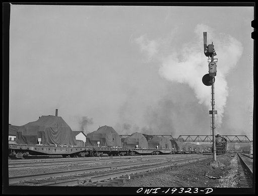 Kansas City, Kansas. Military tanks on their way through the Atchison, Topeka and Santa Fe Railroad yard