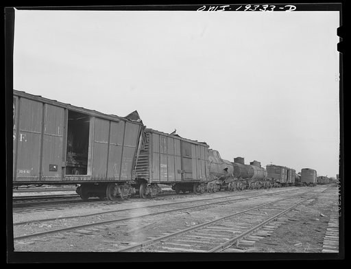 Topeka, Kansas. Wrecked freight cars which will be rebuilt at the Atchison, Topeka and Santa Fe Railroad car shops
