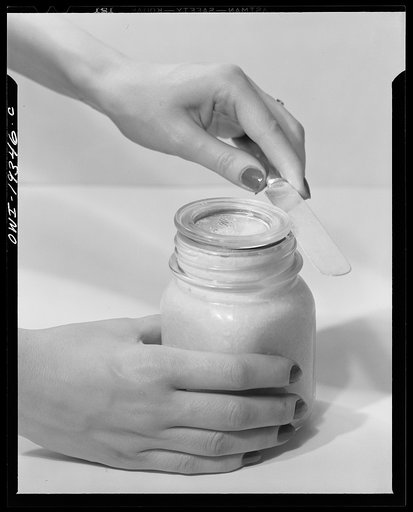 Steel-saving glass-top jars recommended by the War Production Board, Containers Division, for home canning of the Victory garden fruits and vegetables in 1943. To open the jar, insert knife between glass lid and rubber ring