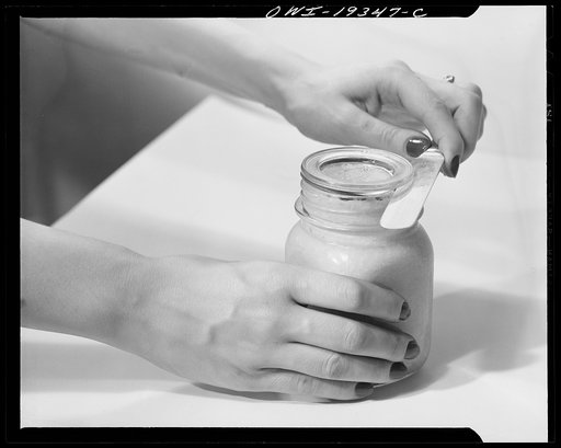 Steel-saving glass-top jars recommended by the War Production Board, Containers Division, for home canning of the Victory garden fruits and vegetables in 1943. To open the jar, insert knife between glass lid and rubber ring