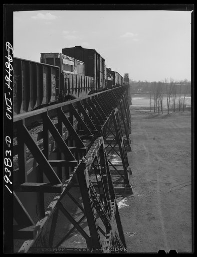 Atchison, Topeka and Santa Fe Railroad freight train crossing a river
