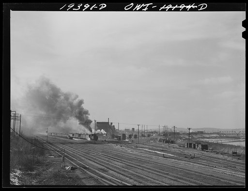 Untitled photo, possibly related to: At the coal and water station of a railroad yard on the route of the Atchison, Topeka and Santa Fe Railroad