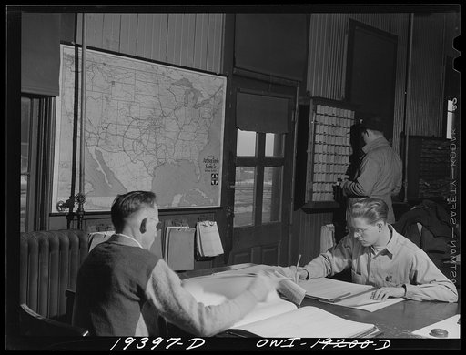 Untitled photo, possibly related to: Fort Madison, Iowa. Keeping records of waybills in the Atchison, Topeka and Santa Fe Railroad yard office