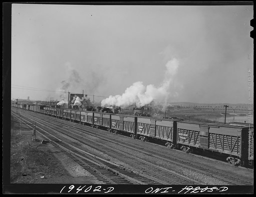 An Atchison, Topeka and Santa Fe Railway train carrying stock cars leaving for the east