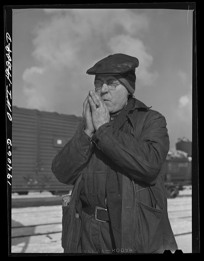 Chicago, Illinois. John Paulinsky, train inspector at the Corwith Railroad yard