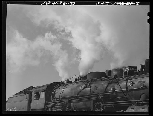 Chicago, Illinois. Engineer gives whistle blasts to indicate Atchison, Topeka and Santa Fe Railway train is ready to leave the yard