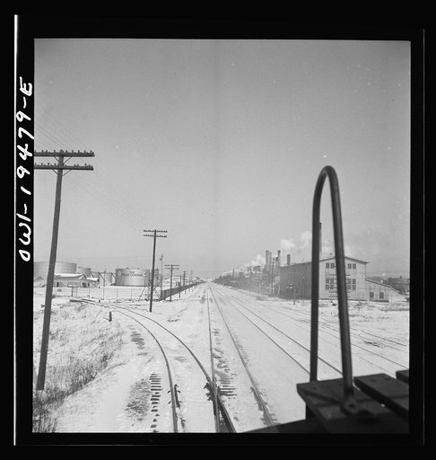 Untitled photo, possibly related to: Lockport, Illinois. Passing the refinery of the Texas Oil Company along the Atchison, Topeka, and Santa Fe Railroad between Chicago and Chillicothe, Illinois