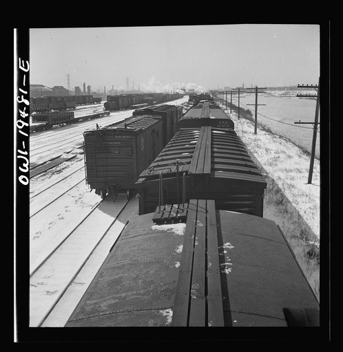 Untitled photo, possibly related to: Joliet, Illinois. Stopping for coal, water and inspection along the Atchison, Topeka, and Sant Fe Railroad between Chicago and Chillicothe, Illinois