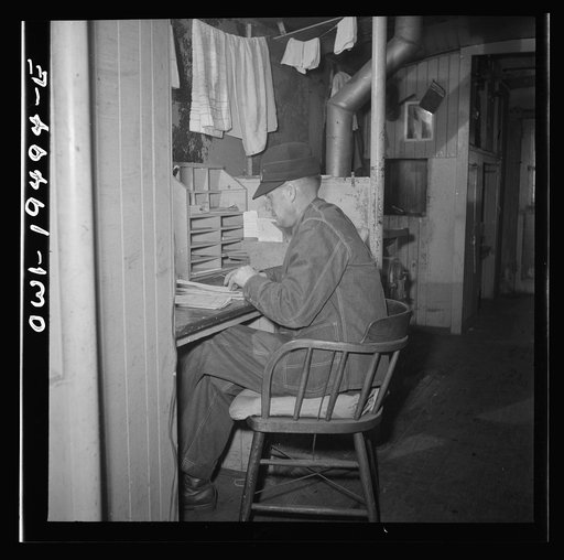 Untitled photo, possibly related to: Conductor George E. Burton, having lunch in the caboose on the Atchison, Topeka, and Santa Fe Railroad between Chicago and Chillicothe, Illinois