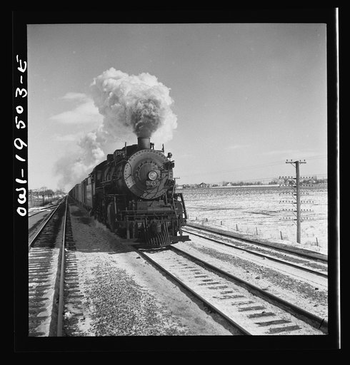 Untitled photo, possibly related to: Chillicothe (vicinity), Illinois. Leaving the helper engine behind, eight miles west of Chillicothe on the Atchison, Topeka and Santa Fe Railroad, on the way to Fort Madison, Iowa