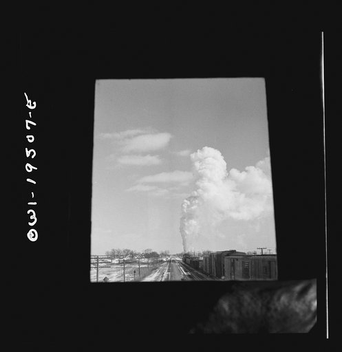 Untitled photo, possibly related to: Streator (vicinity), Illinois. Passing an eastbound freight train on the Atchison, Topeka and Santa Fe Railroad between Chicago and Chillicothe, Illinois. Seen through the window of the cupola