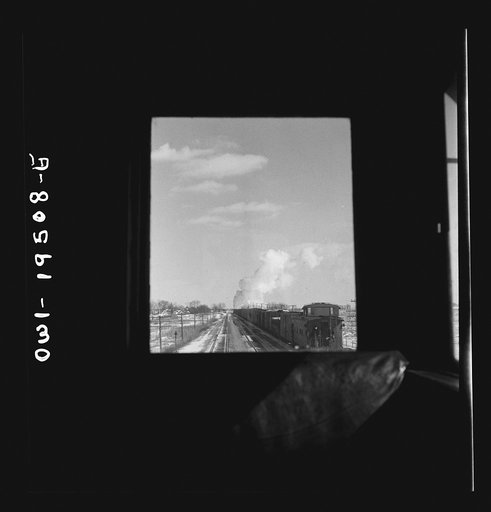 Untitled photo, possibly related to: Streator (vicinity), Illinois. Passing an eastbound freight train on the Atchison, Topeka and Santa Fe Railroad between Chicago and Chillicothe, Illinois. Seen through the window of the cupola