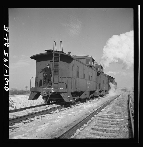 Chillicothe, Illinois. Changing crews and cabooses of a westbound freight train along the Atchison, Topeka and Santa Fe Railroad, between Chicago and Chillicothe, Illinois
