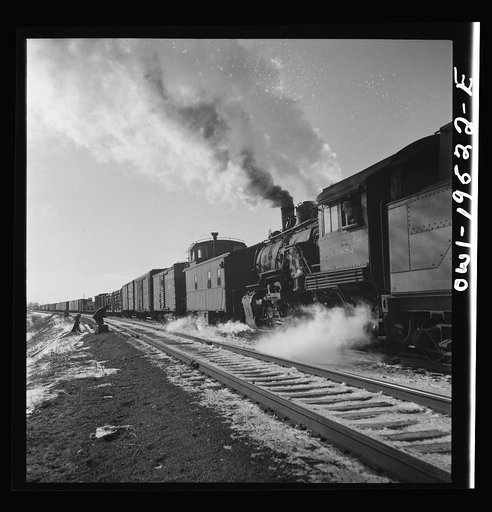 Chillicothe, Illinois. Changing crews and cabooses of a westbound freight train along the Atchison, Topeka and Santa Fe Railroad, between Chicago and Chillicothe, Illinois