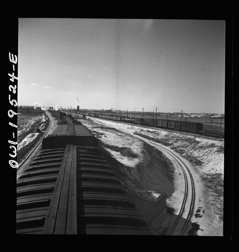 Untitled photo, possibly related to: Joliet, Illinois. Stopping for coal, water and inspection along the Atchison, Topeka, and Sant Fe Railroad between Chicago and Chillicothe, Illinois