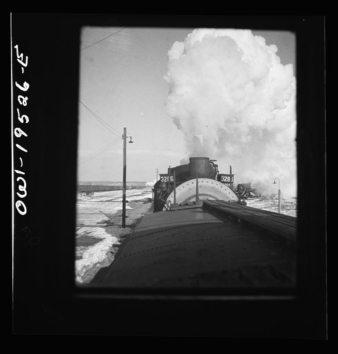 Untitled photo, possibly related to: Chillicothe, Illinois. A helper engine is taken on for added power on a grade extending eight miles on the Atchison, Topeka and Santa Fe Railroad, between Chillicothe, Illinois and Fort Madison, Iowa