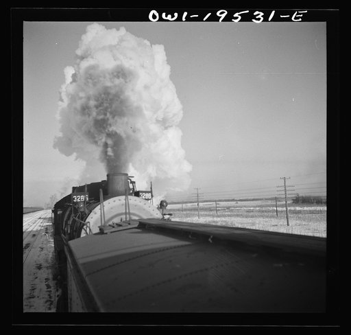 Untitled photo, possibly related to: Chillicothe, Illinois. A helper engine is taken on for added power on a grade extending eight miles on the Atchison, Topeka and Santa Fe Railroad, between Chillicothe, Illinois and Fort Madison, Iowa