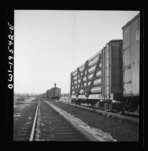 Dahinda, Illinois. On the Atchison, Topeka and Santa Fe Railroad between Chillicothe, Illinois to Fort Madison, Iowa, a coupling pin jumps loose and the train breaks in two. The conductor, riding on top of the train, signals the engineer as they back up in order to couple the cars together again