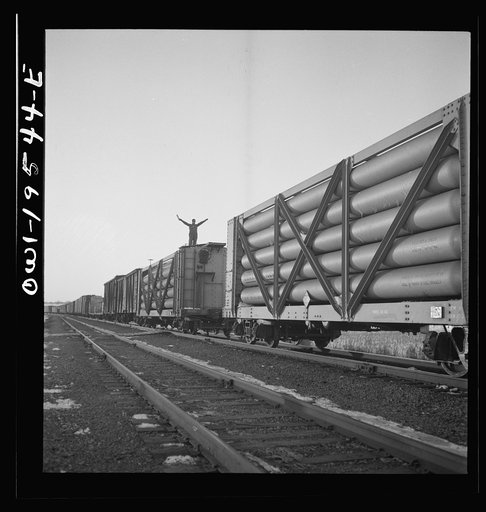 Dahinda, Illinois. On the Atchison, Topeka and Santa Fe Railroad between Chillicothe, Illinois to Fort Madison, Iowa, a coupling pin jumps loose and the train breaks in two. The conductor, riding on top of the train, signals the engineer as they back up in order to couple the cars together again