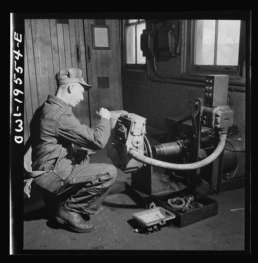 Fort Madison, Iowa. In the train control room at the Shopton shops of the Atchison, Topeka and Santa Fe Railroad. Testing the governor of a train control mechanism