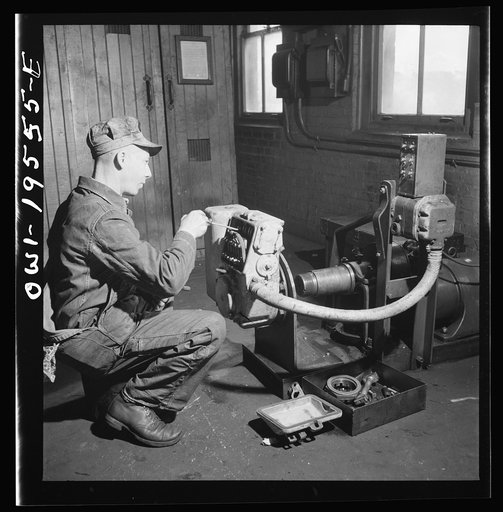 Untitled photo, possibly related to: Fort Madison, Iowa. In the train control room at the Shopton shops of the Atchison, Topeka and Santa Fe Railroad. Testing the governor of a train control mechanism