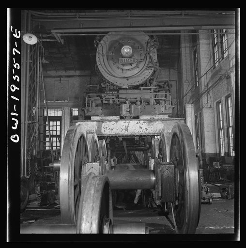 Untitled photo, possibly related to: Fort Madison, Iowa. Wheeling and engine in the locomotive shops of the Atchison, Topeka, and Santa Fe Railroad