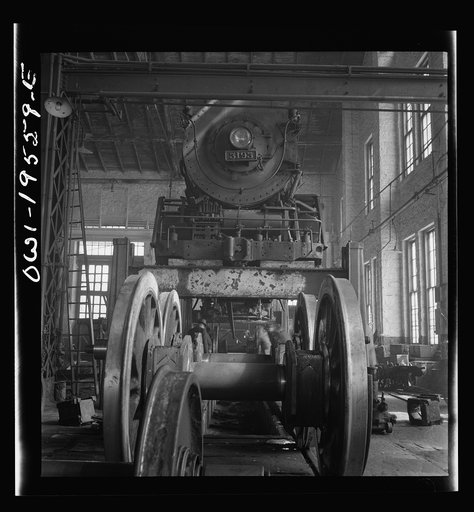Fort Madison, Iowa. Wheeling and engine in the locomotive shops of the Atchison, Topeka, and Santa Fe Railroad