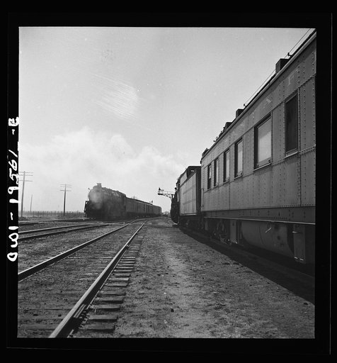 Untitled photo, possibly related to: Chillicothe, Illinois. Changing crews and cabooses of a westbound freight train along the Atchison, Topeka and Santa Fe Railroad, between Chicago and Chillicothe, Illinois