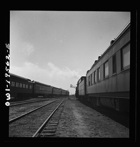 Untitled photo, possibly related to: Chillicothe, Illinois. Changing crews and cabooses of a westbound freight train along the Atchison, Topeka and Santa Fe Railroad, between Chicago and Chillicothe, Illinois