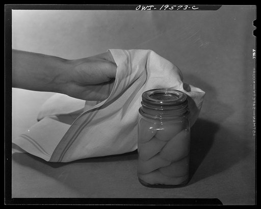 Steel-saving glass-top jars recommended by the War Production Board, Containers Division, for home canning of the Victory garden fruits and vegetables in 1943. Let the jar stand for twelve hours by which time it will have cooled thoroughly. After this the screw bands may be removed permanently since