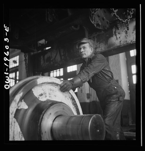 Untitled photo, possibly related to: Fort Madison, Iowa. Wheeling an engine in the Shopton locomotive shops of the Atchison, Topeka, and Santa Fe Railroad